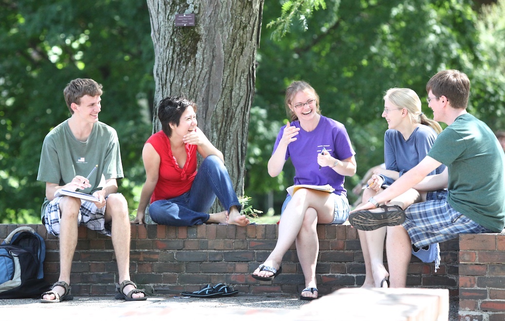 Photo of a Mathcamp mentor with students at TAU.